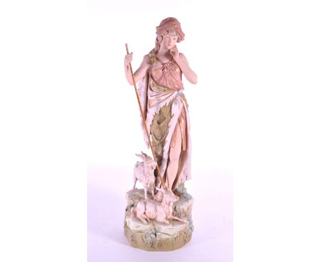 Royal Dux Bohemia - Early 20th century Czechoslovakia bisque porcelain Sheperdess figure in a green and pink colourway. Featu