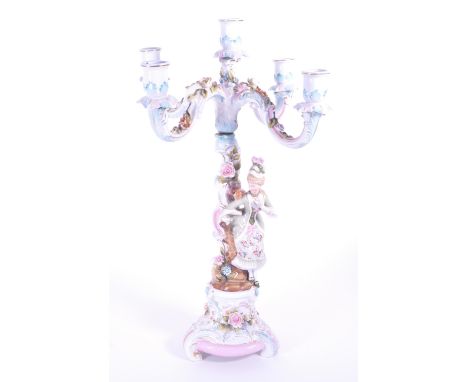 Early 20th century continental porcelain candelabra decorated with a classical lady figure and encrusted with hand painted re