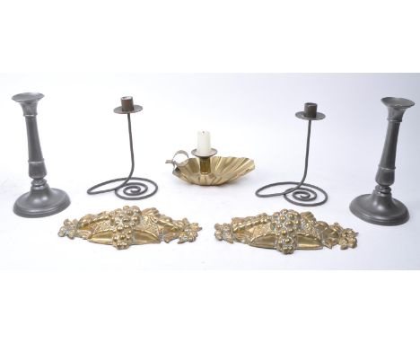 20th century pewter and brass candlestick holders and wall decor, comprised of two pewter candlestick holders, a brass art no