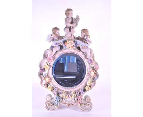20th century vintage continental ceramic cherub mantle clock raised on four scrolled feet and decorated in relief hand painte