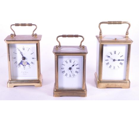 Three 20th century brass carriage clocks. Comprised of an E. A. Combs London Quartz carriage clock, a French A.C.C carriage c
