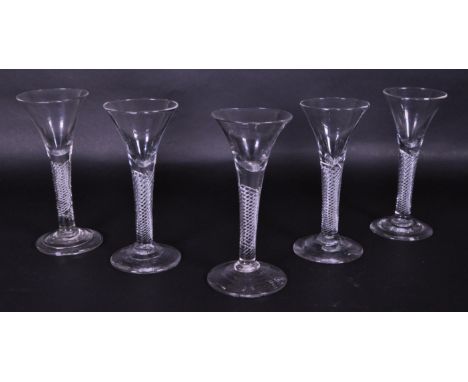 Set of five late 18th century George III drinking glasses. Each featuring an air twist stem with a drawn trumpet bowl top and