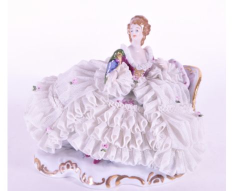 Karl-Heinz Klette - Late 20th century German Dresden porcelain figure of a lady. Featured in a large white lace dress encrust