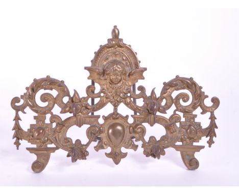 A vintage 20th century brass acanthus leaf table hook stand. With acanthus leaf decoration with female bust to top, four hook