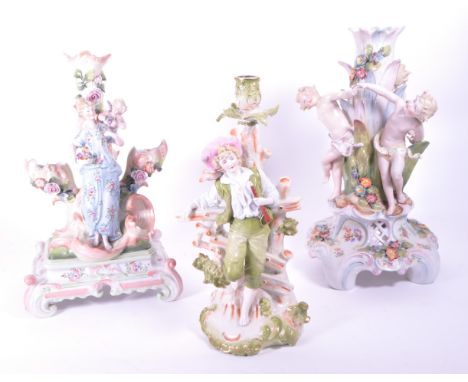 A collection of x3 early 20th Century German porcelain candlestick holders comprising a Stizendorf example in the form of a y