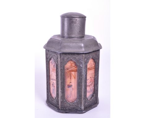 Early 20th century Chinese pewter tea caddy. With removable lid to top, octagonal body with painted panels underneath glass a