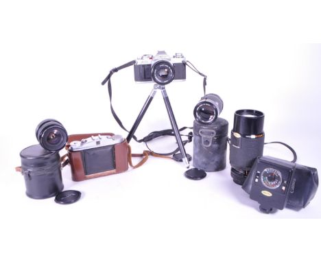 A collection of vintage 20th century cameras and lenses. To include, Canon AV-1, Agfa Isolette, made in Germany, Kiron zoomlo