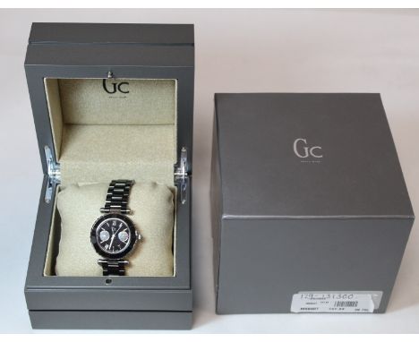 G. C. Guess Collection two-eye day/date lady's wristwatch with black dial, bezel and ceramic bracelet, model no. MX8407, seri