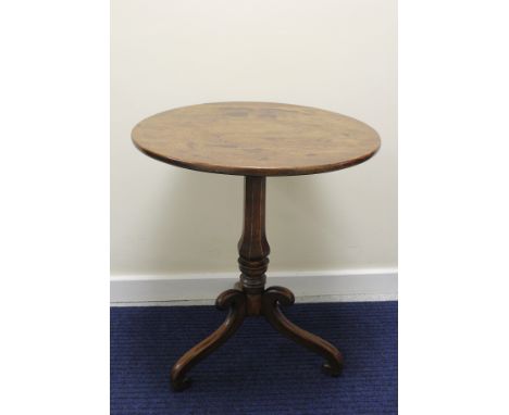 Early 19th century mahogany occasional table, circular snap top, raised on polygonal faceted column on tripod scroll base, 73