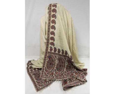 Fine Kashmir cream pashmina wool shawl with polychrome panels of boteh to fringed ends and borders. Slight moth damage. Appro