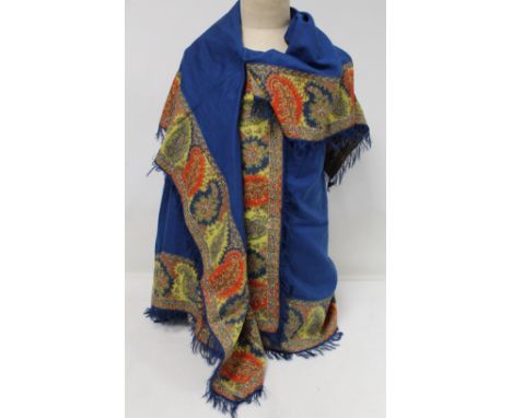 19th century English 'turnover' shawl, the blue wool field with applied polychrome woven borders of boteh and flowers, single