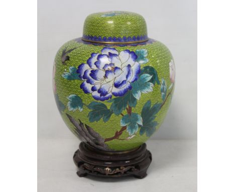 20th century Chinese cloisonné covered jar of ovoidform, decorated with a bird and peonies on lime green scroll ground, 21cm 