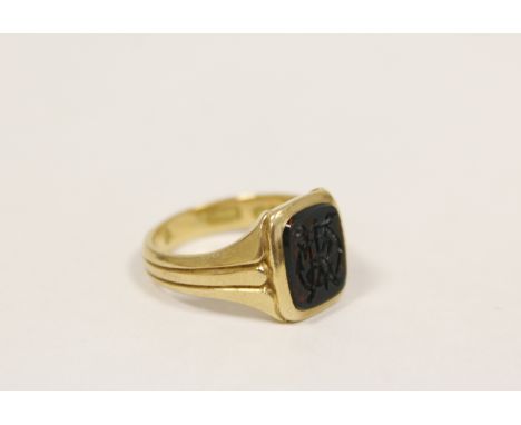 18ct gold signet ring, monogrammed on bloodstone, 6.8g gross. Size 'K'. Condition:Inscribed J B. McL & R.B.L 1898. good condi