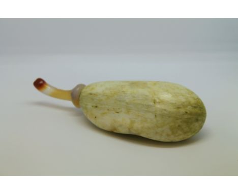 19th century Chinese snuff bottle of pale green jade pebble form with agate stopper in the form of a stalk, 10cm long. Condit