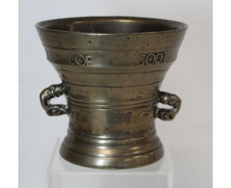 17th century Dutch bronze mortar of flared twin dolphin handled form with foliate scroll banding and worn inscription " Lof G