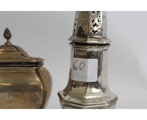 Silver tea caddy of bulbous rectangular form, hinged lid engraved MCC Chester 1901 also a Georgian style silver baluster suga