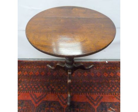 Antique oak tilt top tripod table raised on baluster column. 64cm 