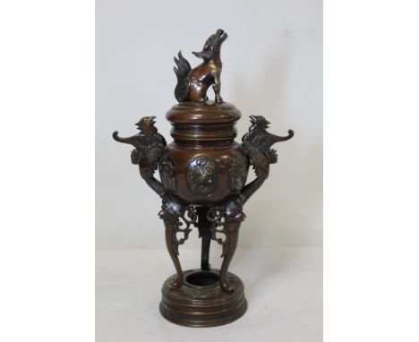 Japanese Meiji period bronze censer with twin phoenix handles, moulded floral panels on three mask head supports and circular