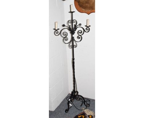 A wrought metal three light standard lamps formed as a candle stand, 161cm high 