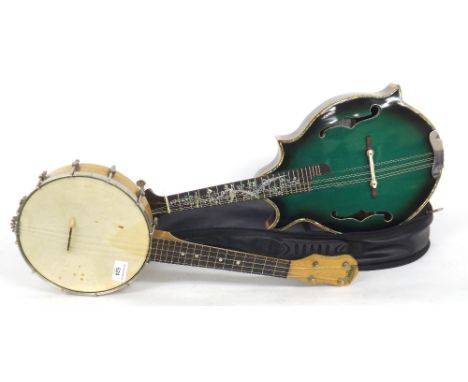 Pennant banjolele, together with a decorative mandolin with green finish table and peacock pearl inlay to the fretboard and b