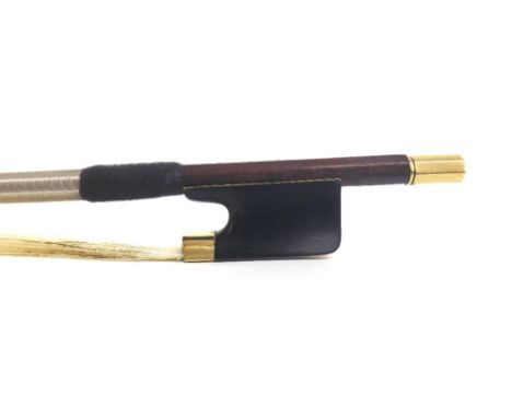 German gold mounted violin bow stamped H.R. Pfretzschner, the stick octagonal, the ebony frog plain and with a gold overlaid 