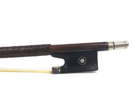 Silver mounted violin bow stamped Emile Ouchard, the stick round, the ebony frog inlaid with silver rings enclosing pearl eye