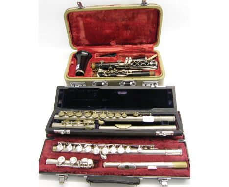 Boosey & Hawkes Regent clarinet, no. 359226, case; together with two cased metal flutes, one stamped Opal, the other Bach ser