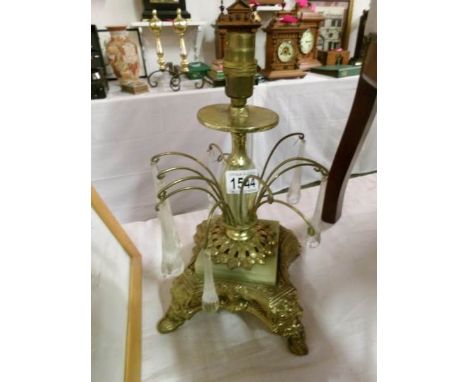 A gilt and onyx table lamp
