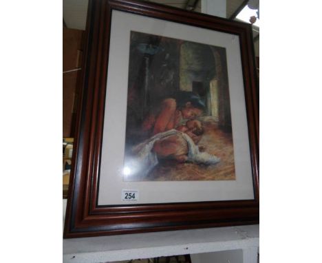A framed and glazed print of mother and baby