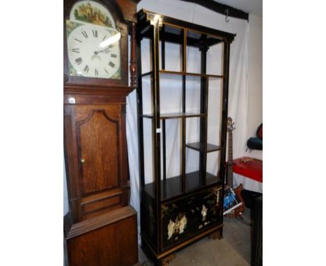 A lacquered shelf unit with 2 bottom cupboards the doors decorated with Geisha's