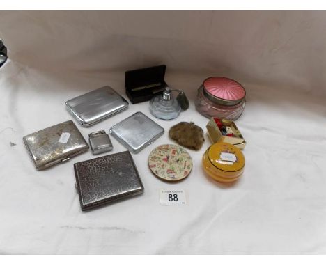 4 cigarette cases, a lighter, a powder bowl, a perfume bottle etc
