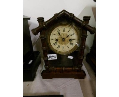 A German made mantel clock with bamboo effect door