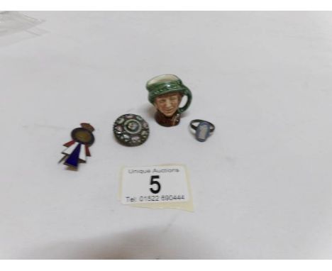 An old Wedgwood silver ring, a millifiori brooch, an enamel brooch and a miniature Doulton jug
