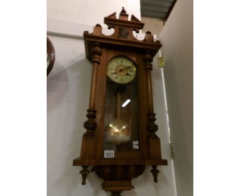 A mahogany wall clock