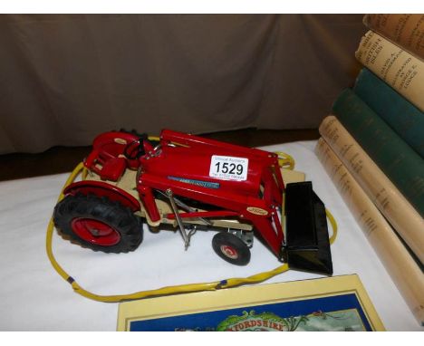 A 1960/70's Japanese tin plate remote controlled Ford tractor