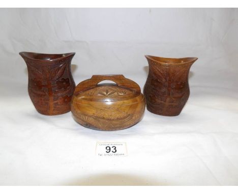A pair of carved wood vases and one other item