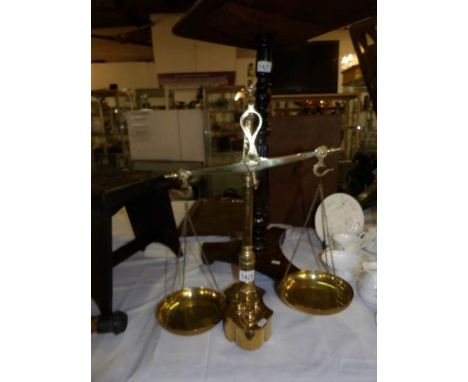 A set of brass balance scales and weights