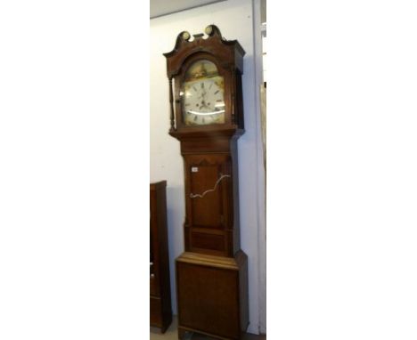 A James Usher of Lincoln mid 19th century 8 day long case clock in oak case with painted dial
