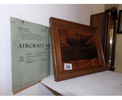 A copper engraving of a Halifax aircraft and an Aircraft servicing manual
