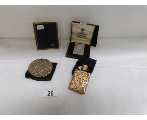 A French perfume bottle, a powder compact, a cigarette case and a cased Ronson lighter