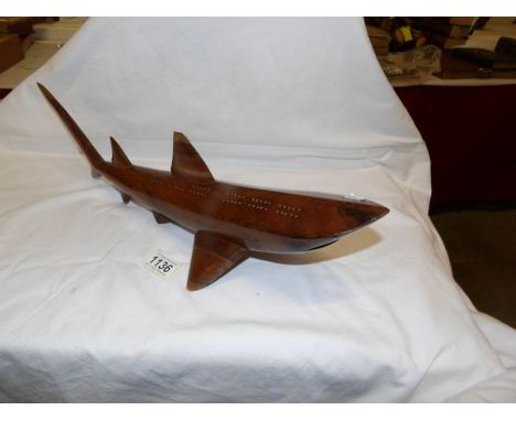 A superb quality cribbage board in the shape of a shark and having real shark's teeth, 52cm from tip of tail to snout