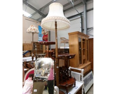 An oak standard lamp with shade