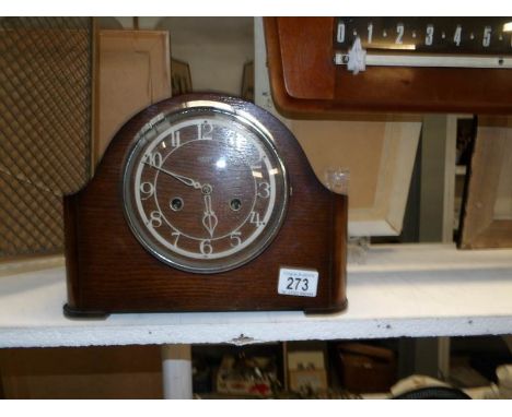 An oak mantel clock