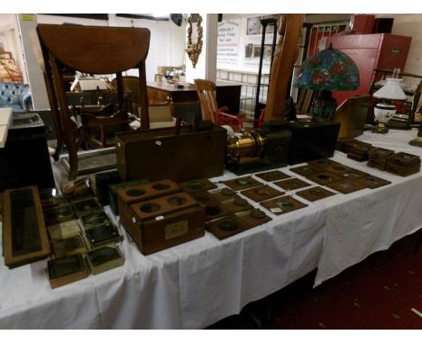 A Victorian magic lantern with large collection of coloured glass slides including Arundel & Marshall, Carpenter & Wesley, so