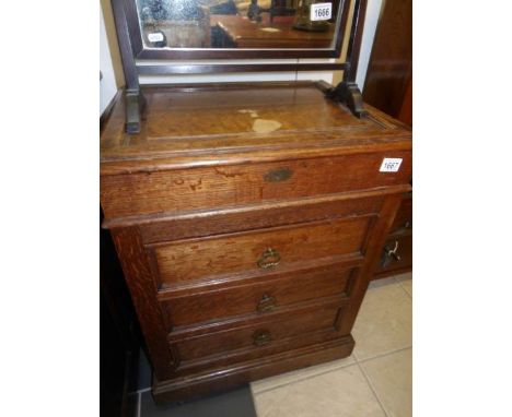 A light oak artist's cabinet