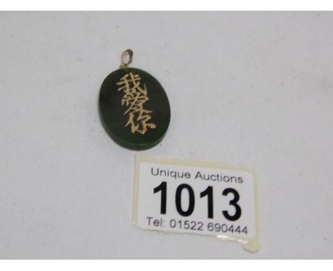 A jade good luck pendant
