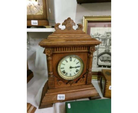 An oak mantel clock