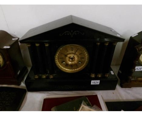 A black marble Paladian style mantel clock