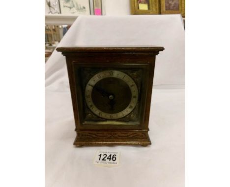 An oak cased Elliott mantel clock in working order