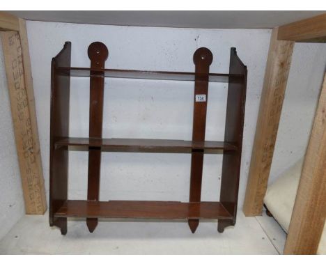 A mahogany wall shelf